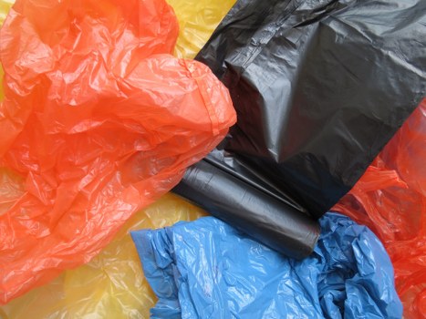 Workers sorting recyclables at a commercial recycling point in north London